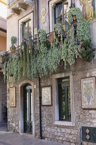 backstreet; balcony; ceramic heads; ceramic panels; decorated panels; Europe; European; green