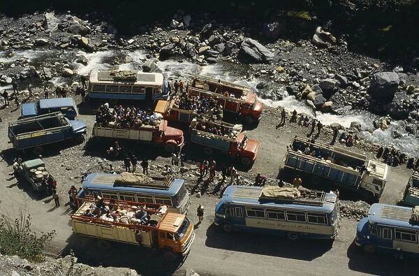 BOLIVIA, Yungas Road block on road to La Paz with view over buses
