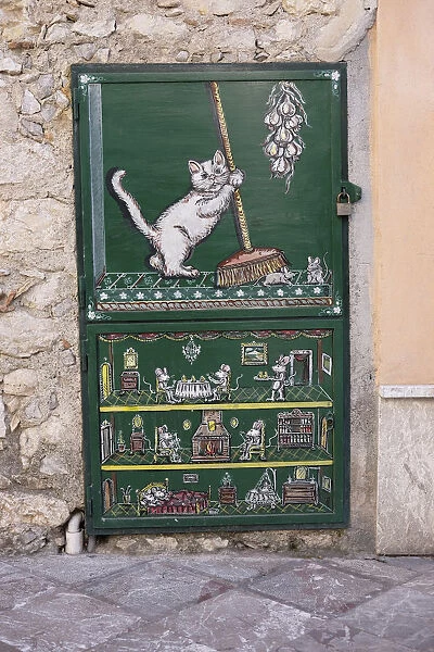 brush; cat; decoration; decorative; Europe; European; Italian; Italy; painted door; paved street