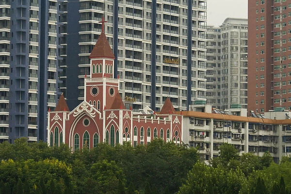 China, Hubei, Wuhan The Catholic Cathedral among modern apartment blocks