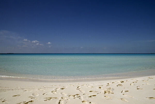 Cuba, Isla de Juventude, Caya Largo, Playa Serena, looking out to sea with footprints in