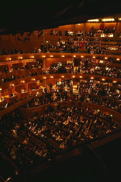 ENGLAND, East Sussex, Glyndebourne Interior of auditorium with audience members taking