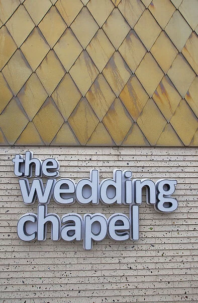 England, Lancashire, Blackpool, Seafront promenade with Wedding Chapel sign and exterior detail