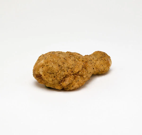 Food, Cooked, Poultry, Single breaded chicken drumstick on a white background