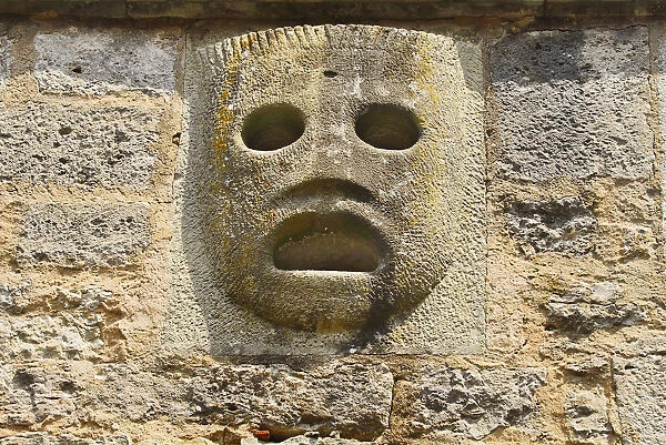 Germany, Bavaria, Rothenburg ob der Tauber, Burgtor or Castle Gate, Detail featuring the Hot Pitch Mask for pouring hot oil, tar and other boiling liquids on uninvited guests