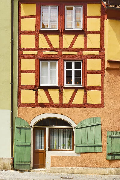 Germany, Bavaria, Rothenburg ob der Tauber, Facade of a colourful half timbered house