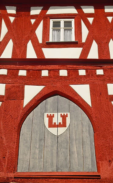 Germany, Bavaria, Rothenburg ob der Tauber, Shapes and Patterns on a half timbered house in Marktplatz with the towns coat of arms