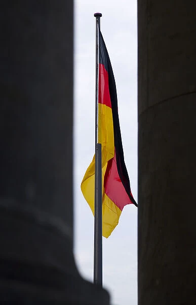 Germany, Berlin, Mitte, a black, red and yellow national flag hanging down from a