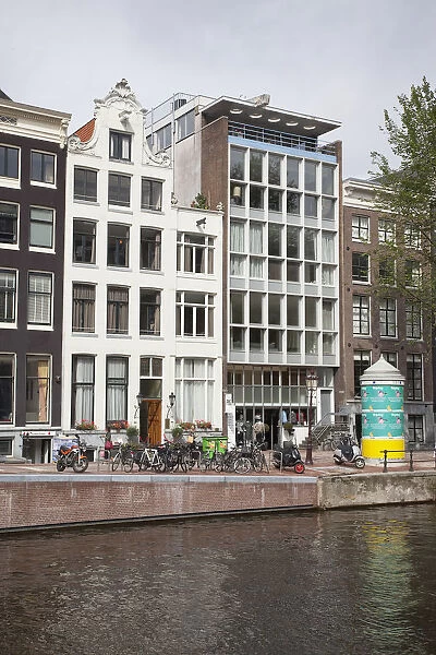 Holland, North, Amsterdam, Contrasting new and typical Dutch buildings