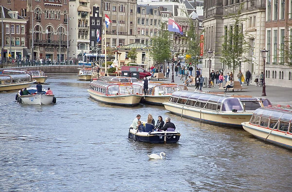 Holland, North, Amsterdam, Tourists on canal tour boats