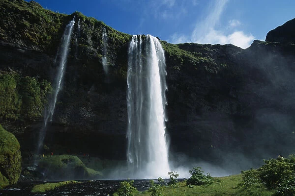 Iceland, Seljalandfoss, Waterfall plunging over mountain side of West Eyjafjoll