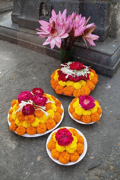 India, Bihar, Bodhgaya, Floral offering left by a pilgrim at the Mahabodhi Temple