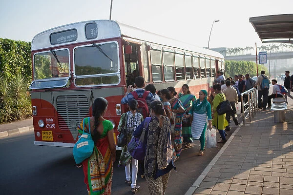 India, Mumbai, Passengers board a bus outside Chhatrapati Shivaji International Airport
