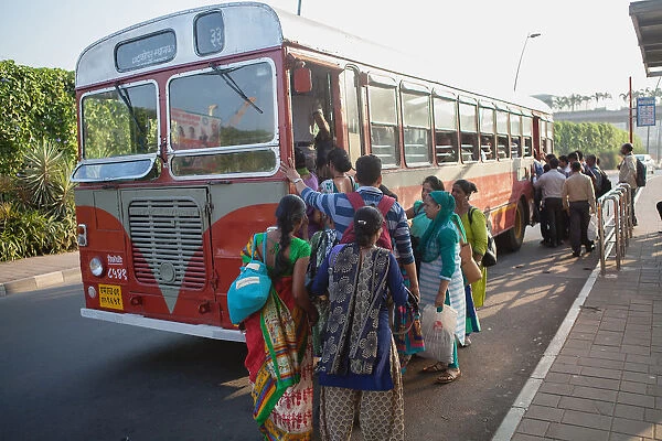 India, Mumbai, Passengers board a bus outside Chhatrapati Shivaji International Airport