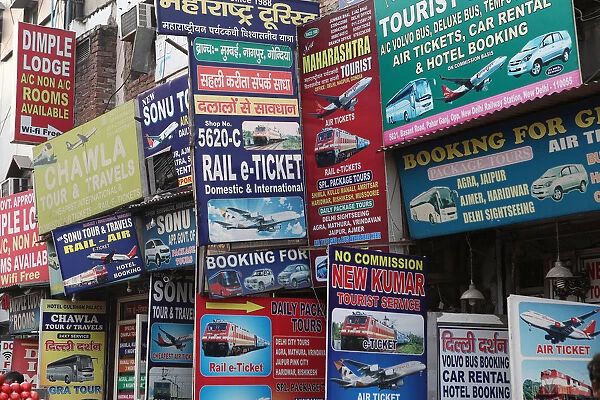 India, New Delhi, Advetisement boards and hoardings for travel services in the Paharganj district of Delhi