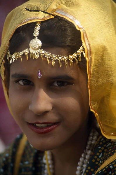 INDIA, Rajasthan, Alwar Head and shoulders portrait of a young girl at the Alwar Utsav