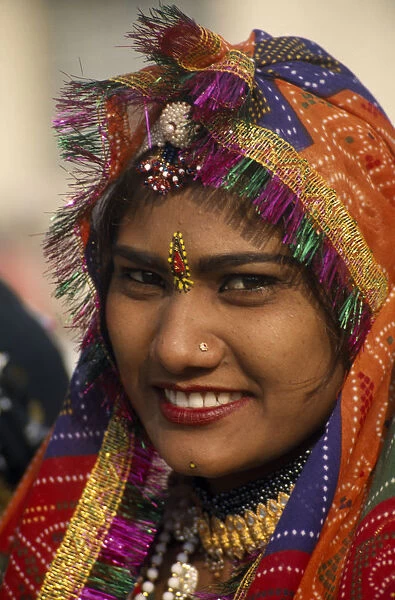 INDIA, Rajasthan, Alwar Portrait of a female dancer smiling at the Alwar Utsav