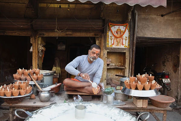 India, Uttar Pradesh, Allahabad, A vendor selling mishti doi sweet curd at a food hotel