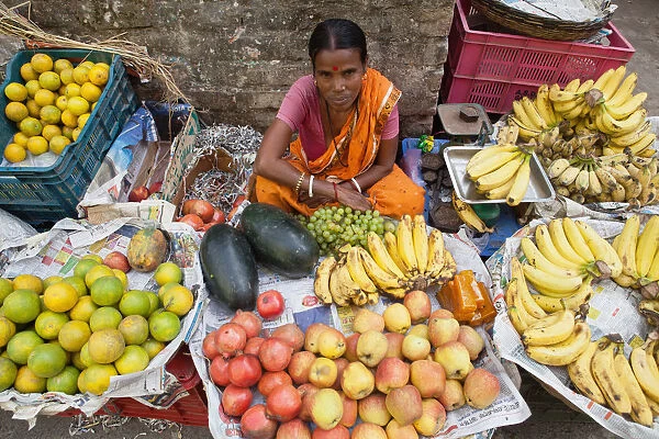 India, West Bengal, Kolkata, Fruit vendor at the market in the Garia district