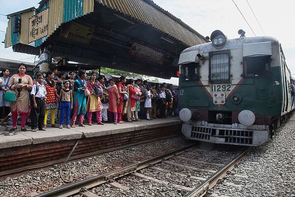 India, West Bengal, Kolkata, A train arrives at the platform at Garia Railway Station