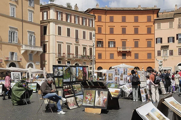 Italy, Lazio, Rome, Centro Storico, Piazza Navona, general scene with artist stalls