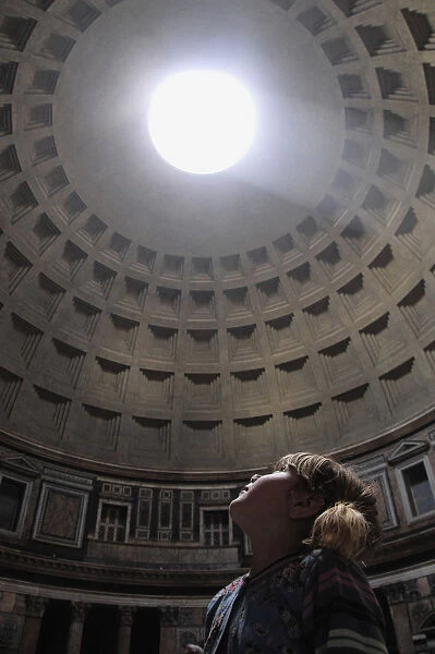 Italy, Lazio, Rome, Centro Storico, Pantheon, child looking up at oculus with light shining through