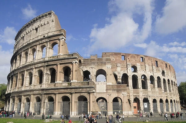 Italy, Lazio, Rome, Colosseum, classic view of the Colosseum with blue sky & light cloud