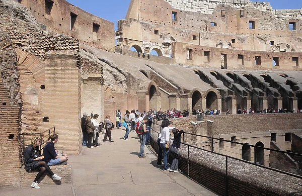 Italy, Lazio, Rome, Colosseum, interior view of the Colosseum with people walking around