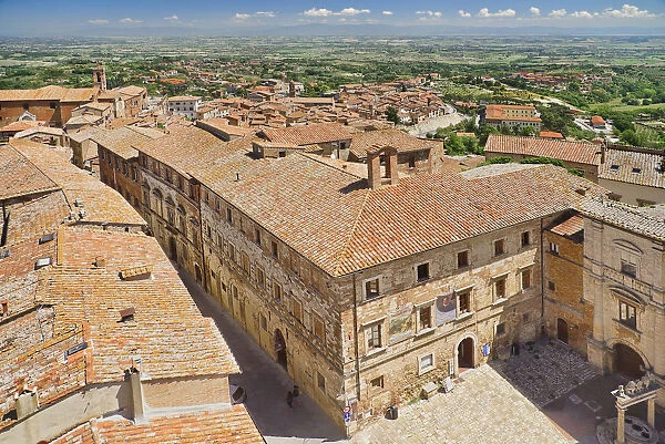 Italy, Tuscany, Montepulciano, View over the rooftops of the town towards distant hills from the tower of Palazzo Comunale or Town Hall