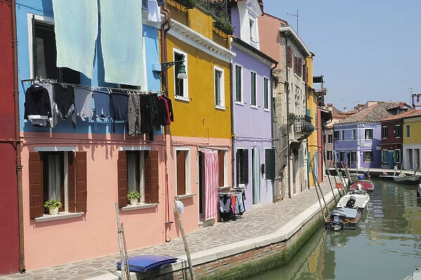 Italy, Veneto, Venice, Burano, colourful houses along canalside