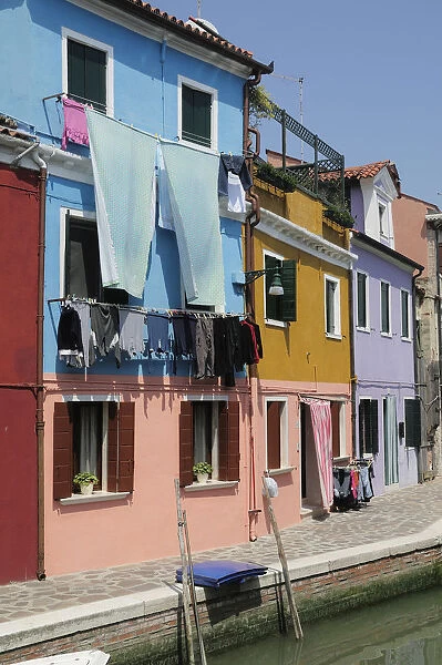 Italy, Veneto, Venice, Burano, colourful houses along canalside