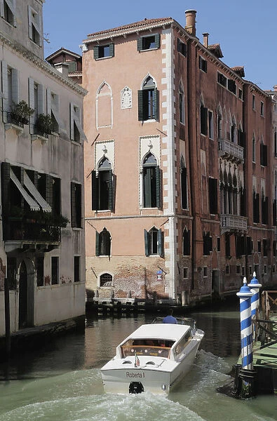 Italy, Veneto, Venice, canal scene with taxi boat