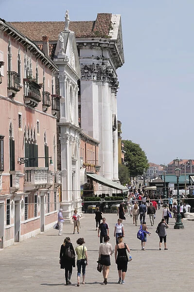 Italy, Veneto, Venice, Zattere, people walking along Fondamente Zattere beside Gesuati