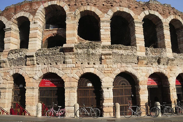 Italy, Veneto, Verona, Arena arches in warm light, Piazza Bra