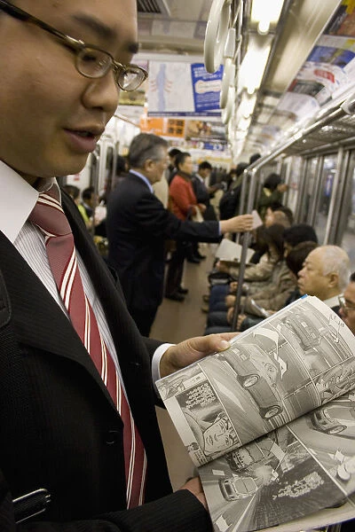 JAPAN 43. Japan /  Tokyo /  Tokyo Metro. Young Japanese man is showing his