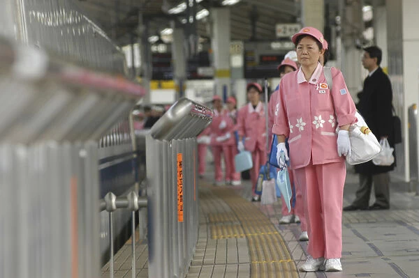 Japan Tokyo Middle aged woman part of cleaning crew