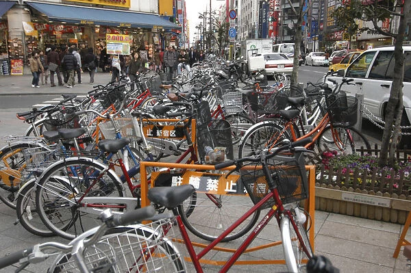 Japan Tokyo Shinjuku outside station bicycles clutter the sidewalk