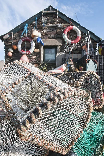Lobster pots outside a fishermans house on the isle of Easdale