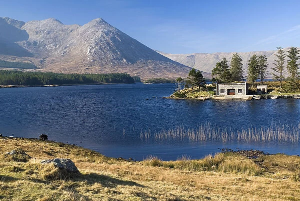 Lough Inagh with boat house and Twelve Bens Mountains behind