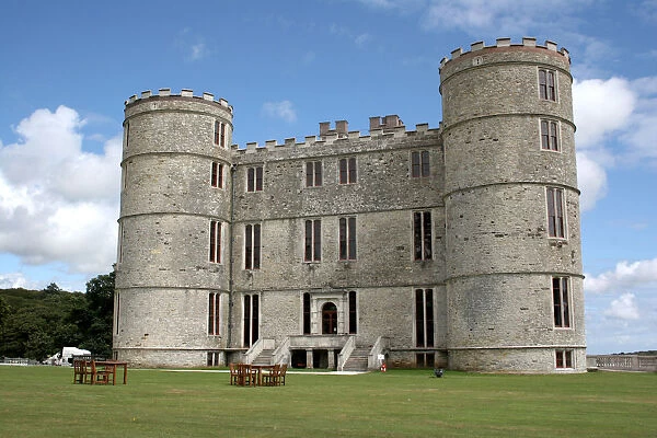 Lulworth Castle with tables and chairs on lawns outside