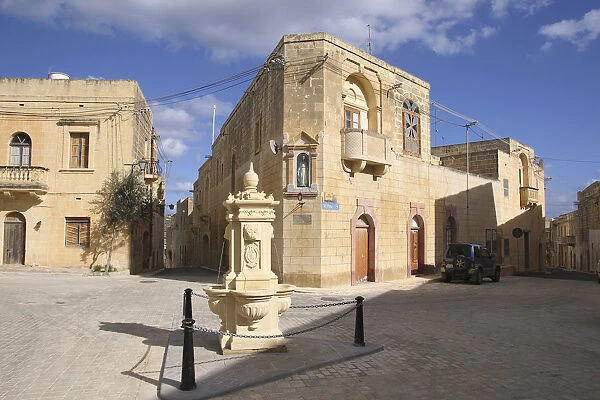 Malta, Gozo, Gharb, old town with stone fountain