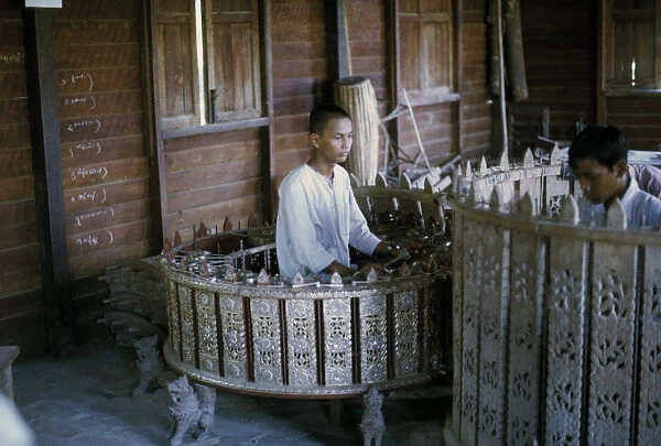 Myanmar, Mandalay, Traditional musician playing Pat Waing drum circle