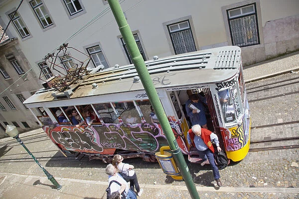 Portugal, Estremadura, Lisbon, Bairro Alto, Elevador da Gloria, Funicular railway tram covered in graffiti