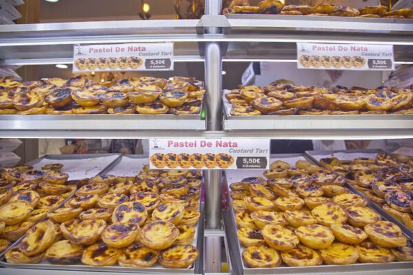Portugal, Estremadura, Lisbon, Baixa, Display of custard cakes and pastries