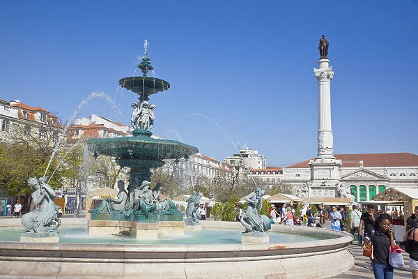 Portugal, Estremadura, Lisbon, Baixa, Praca Rossio with fountain and Statue of King Pedro IV in the centre of the square
