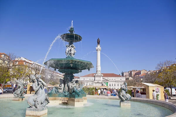 Portugal, Estremadura, Lisbon, Baixa, Praca Rossio with fountain and Statue of King Pedro IV in the centre of the square