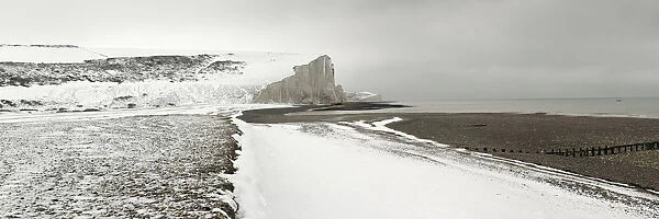 The snow covered chalk cliffs of the Seven Sisters viewed from Cuckmere Haven
