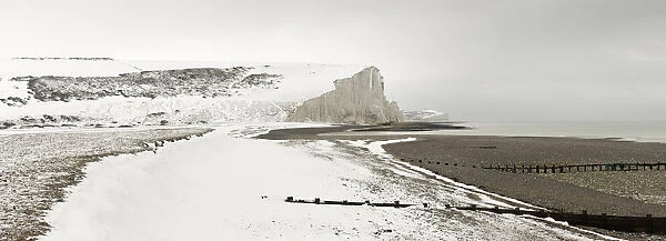 The snow covered chalk cliffs of the Seven Sisters viewed from Cuckmere Haven