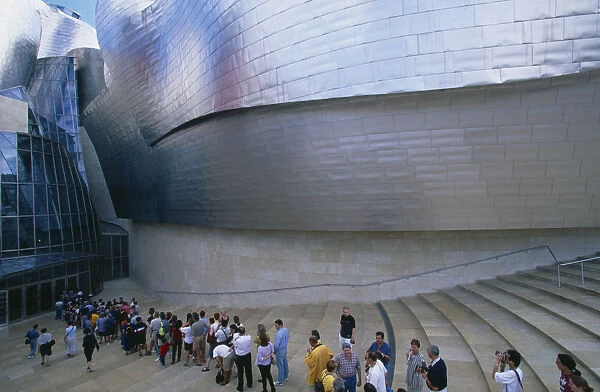 Spain, Basque Province, Bilbao, Queue of people waiting to enter the Guggenheim Museum, designed by Frank Gehry