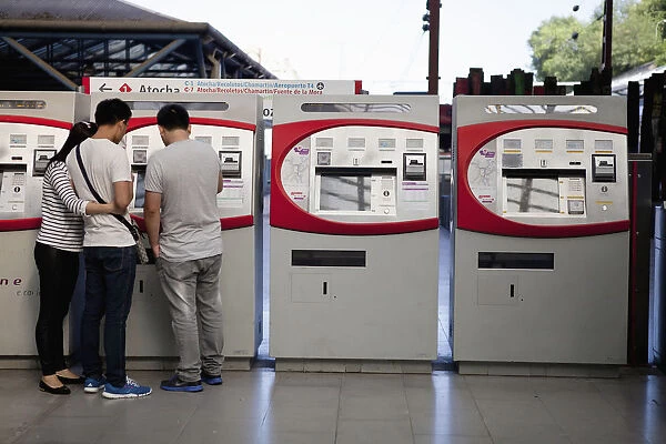 Spain, Madrid, Self-service ticket machines at Principe Pio metro station
